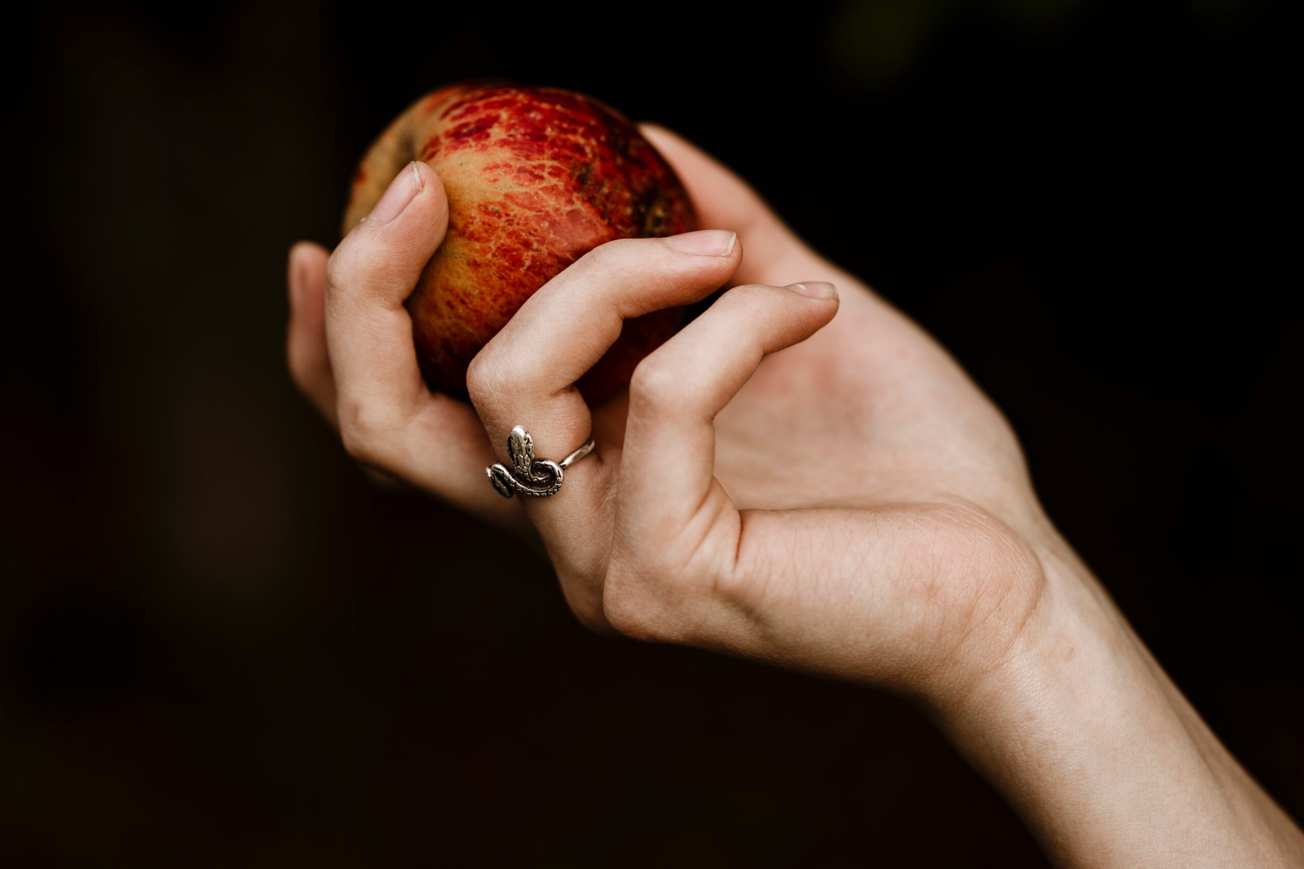 Woman’s hand holding fruit