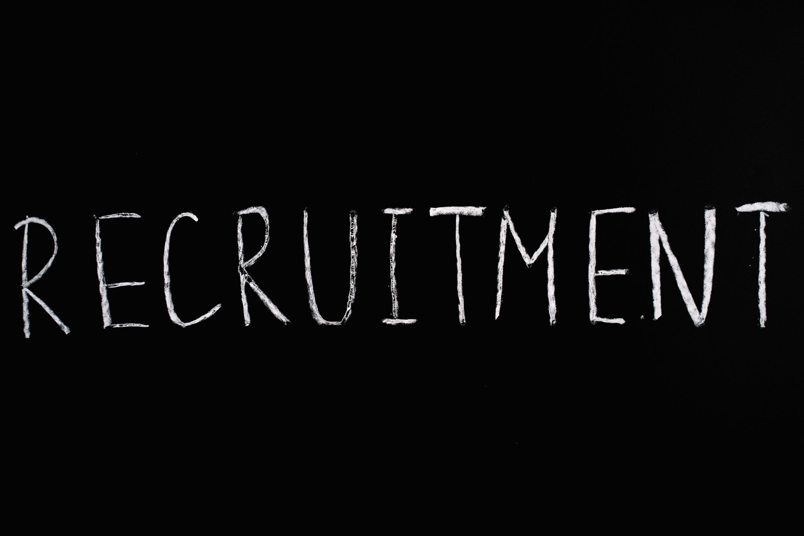 Blank black background with the word “Recruitment” written in white and all caps.