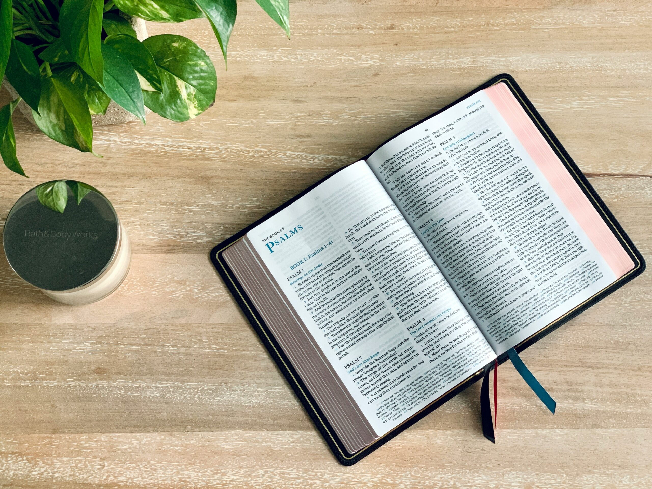 Picture of a Bible on a wooden table.